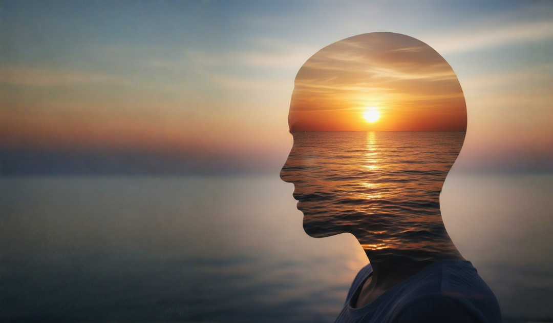 Silhouette profile with a sunset ocean scene blended inside the head.